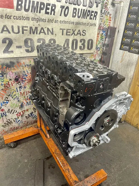 Black engine build on an orange stand