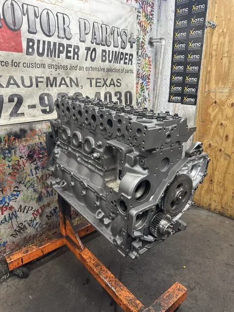 Silver engine beside the shop banner