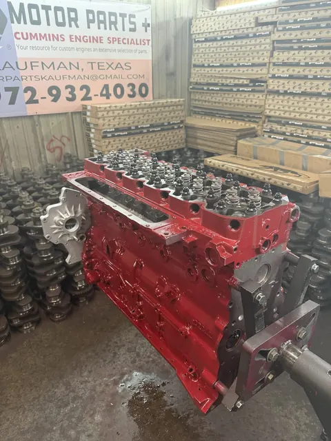Red engine beside the parts shelves