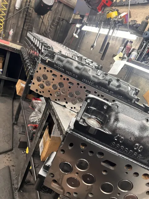 Cylinder heads and parts on the workbench