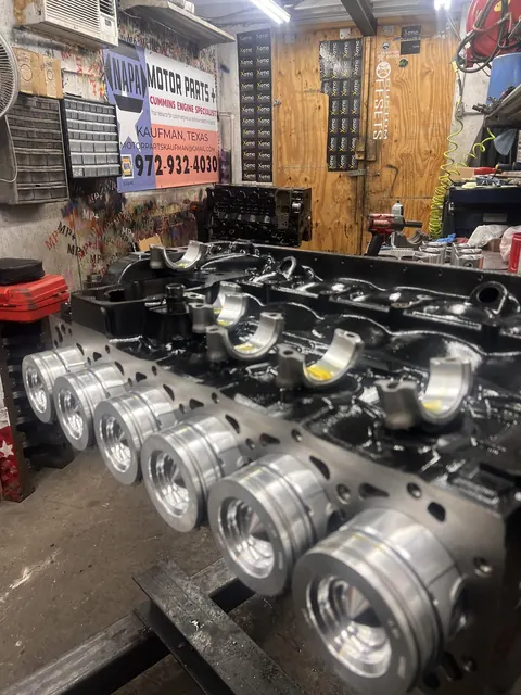 Pistons and engine components on the bench