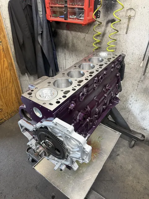 Purple engine block with pistons installed