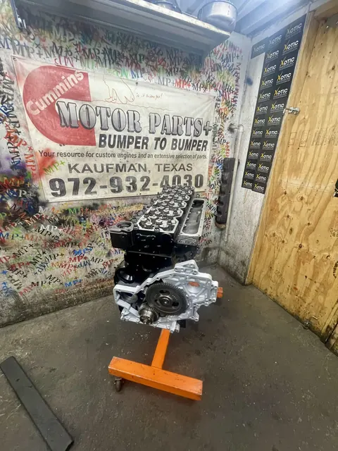 Black engine on an orange stand